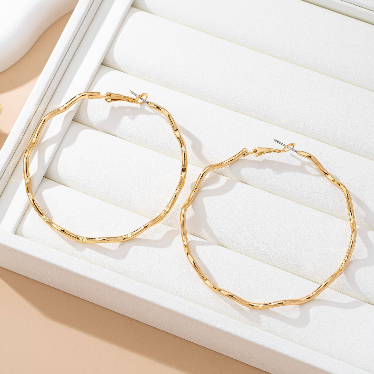 JOSSLYN by wall to wall - Oversized Hammered Gold Wavy Hoop Earrings | 80E61830: GOLD