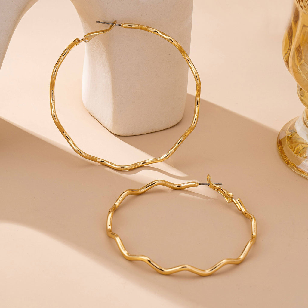 JOSSLYN by wall to wall - Oversized Hammered Gold Wavy Hoop Earrings | 80E61830: GOLD