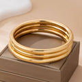 JOSSLYN by wall to wall - Chunky Triple Tube Bangle Set | 80B1604: GOLD