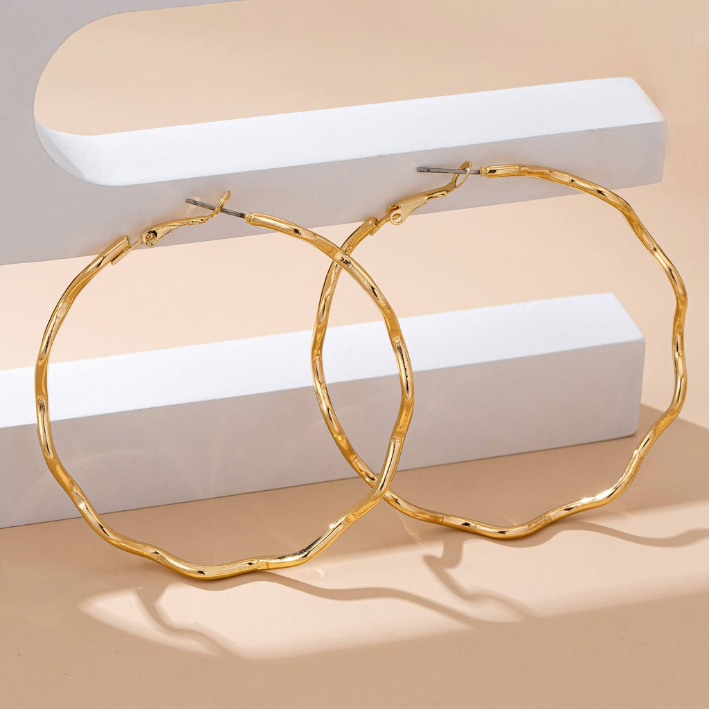 JOSSLYN by wall to wall - Oversized Hammered Gold Wavy Hoop Earrings | 80E61830: GOLD